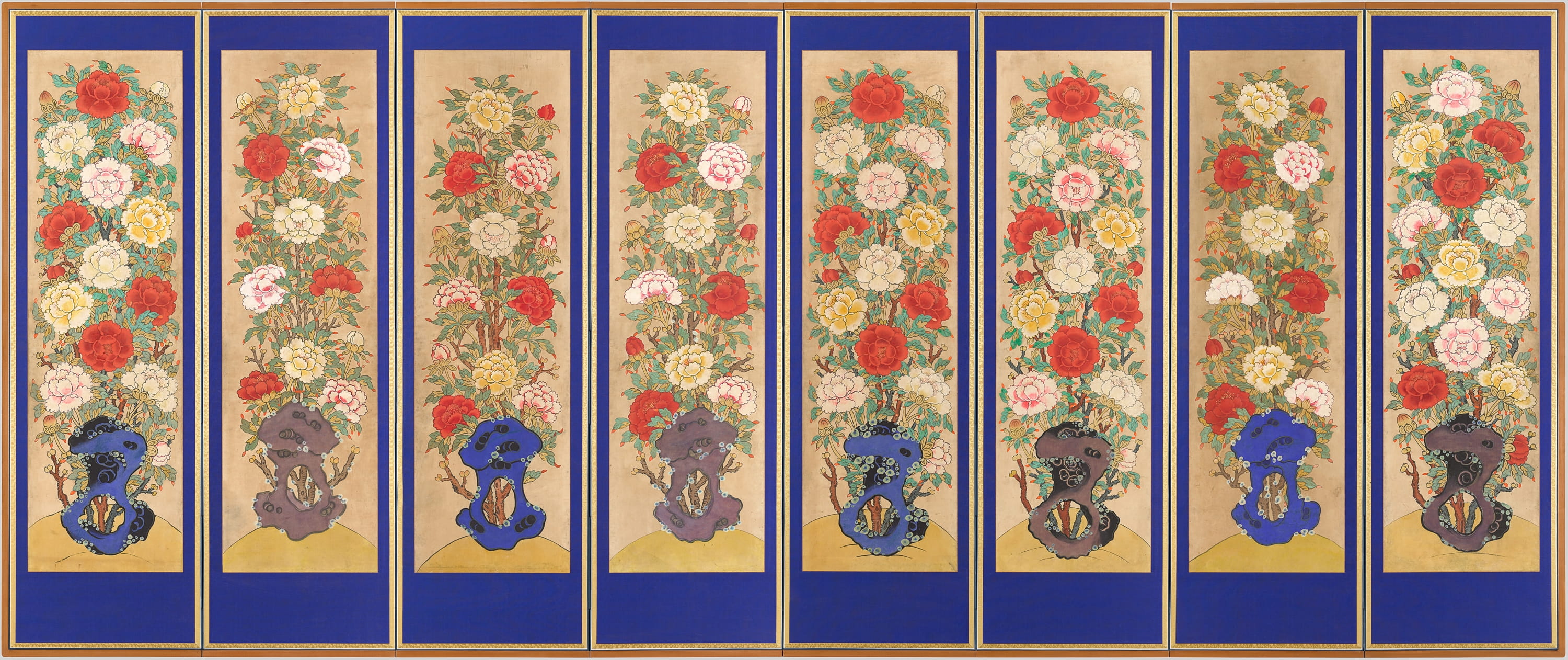 Eight vertical panels, each with an individualized peony plant that extends the full height of the panel. The panels feature a light brown background surrounded by a bright blue border and a thinner gold border. The peonies are red, pink, light yellow, and white.